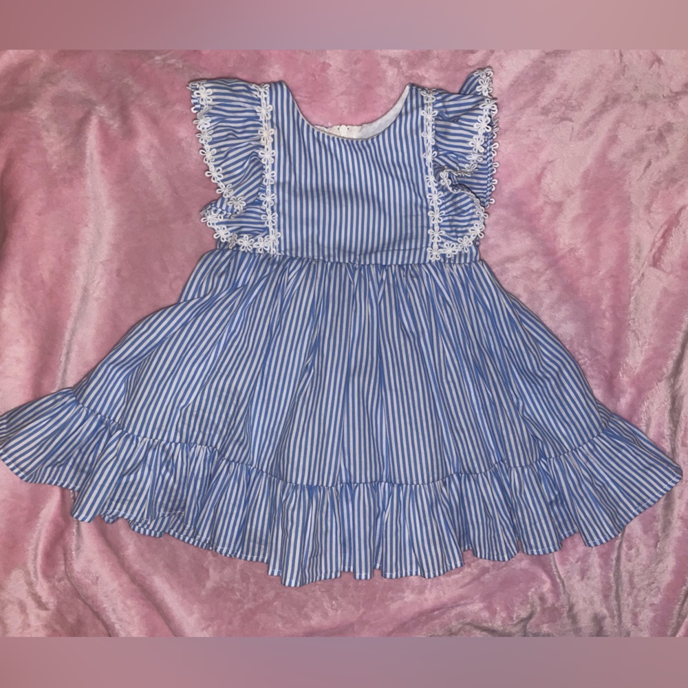 Sweet little ruffle dress with eyelet detail